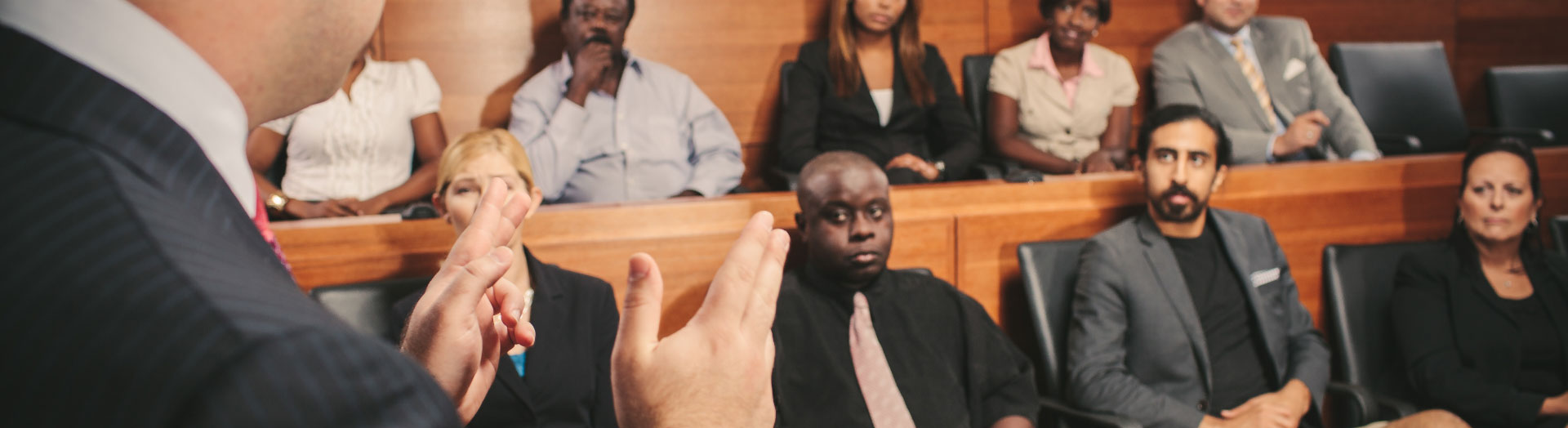 courtroom jury listening to Attorney Fienman